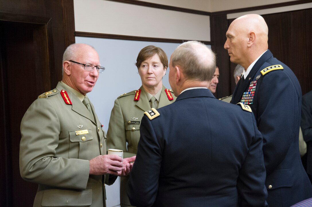 U.S. Army Gen. Martin E. Dempsey, chairman of the Joint Chiefs of Staff, and U.S. Army Chief of Staff Gen. Ray Odierno talk with Australian Defense force Chief army Gen. David Hurley at National Defense University on Fort McNair in Washington, D.C., Nov. 21, 2013.