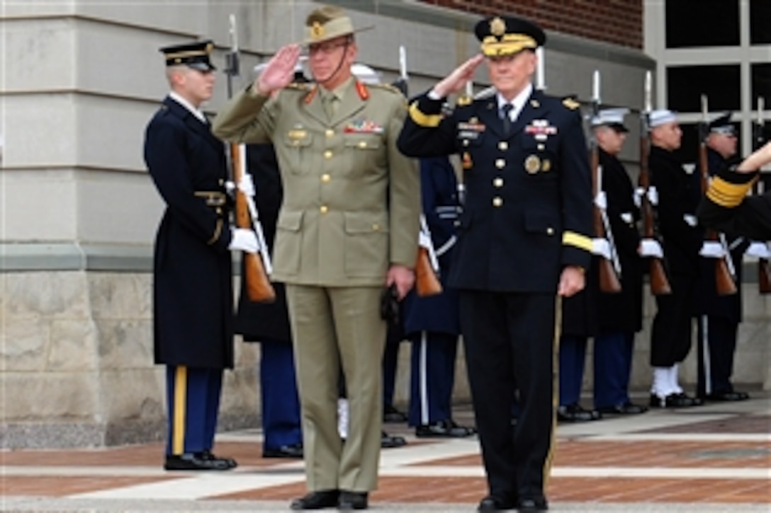 U.S. Army Gen. Martin E. Dempsey, right, chairman of the Joint Chiefs of Staff, and Australian army Gen. David Hurley, chief of Australia’s defense force, render honors during an honors cordon on Fort Lesley J. McNair in Washington, D.C., Nov. 21, 2013