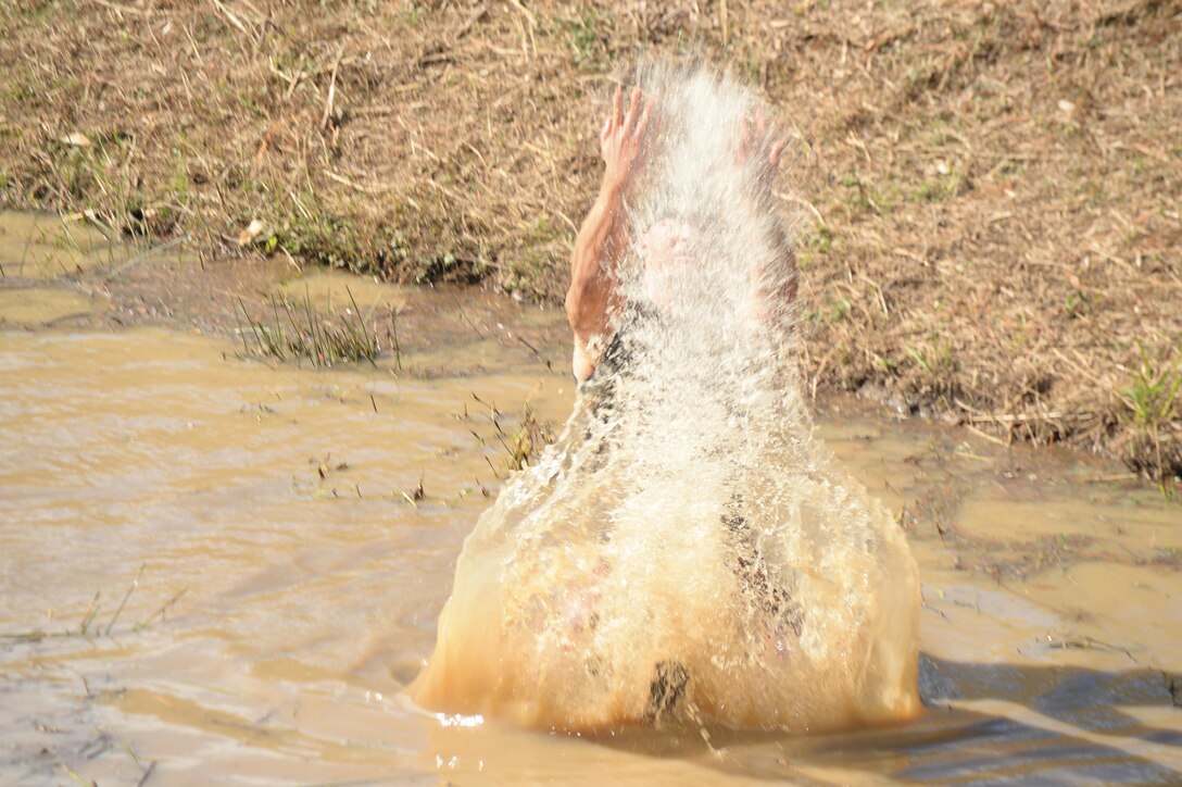 The young and young-at-heart challenge themselves during Marine Corps Logistics Base Albany’s second annual Dirty Devil Dog Mud Run, Saturday. Marines, families and citizens from neighborhoods surrounding the base, navigated obstacles, slogged through mud and water during the more than 3-mile course.