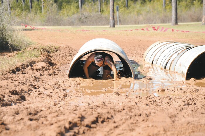 The young and young-at-heart challenge themselves during Marine Corps Logistics Base Albany’s second annual Dirty Devil Dog Mud Run, Saturday. Marines, families and citizens from neighborhoods surrounding the base, navigated obstacles, slogged through mud and water during the more than 3-mile course.