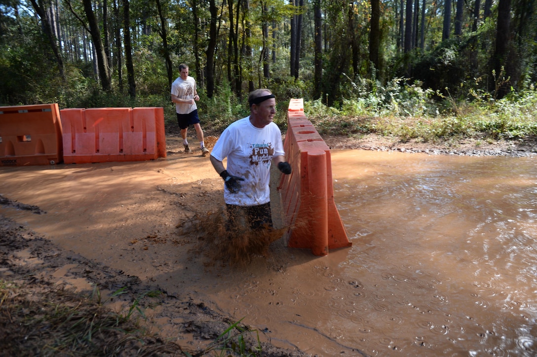 The young and young-at-heart challenge themselves during Marine Corps Logistics Base Albany’s second annual Dirty Devil Dog Mud Run, Saturday. Marines, families and citizens from neighborhoods surrounding the base, navigated obstacles, slogged through mud and water during the more than 3-mile course.