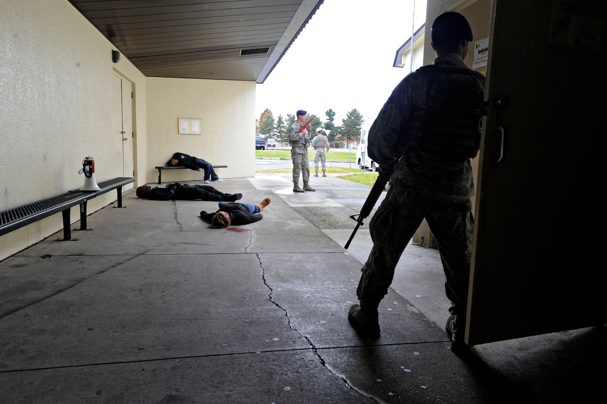 MISAWA AIR BASE, Japan -- Members of the 35th Security Forces Squadron secure a simulated crime scene during an Active Shooter Emergency Management Exercise, at Edgren High School, Nov. 20, 2013. Defenders conducted three days of trainings at several schools on base to prepare for incidents similar to this. (U.S. Air Force photo by Staff Sgt. Tong Duong/ Released)
