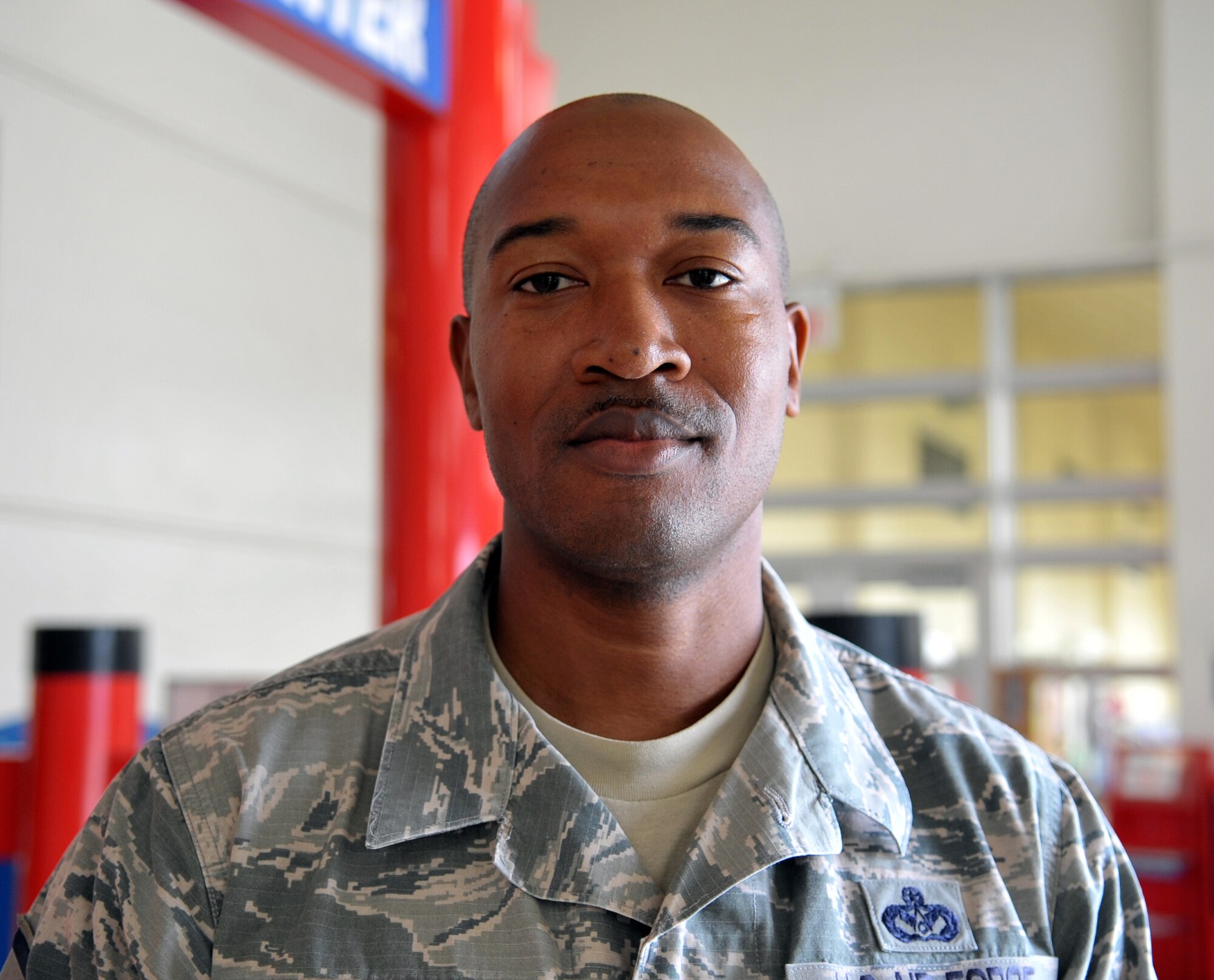 U.S. Air Force Master Sgt. Edmond Bady enjoys hanging out with family and being overseas he considers his work section family. They get together and enjoy some of his favorite homemade-style dishes including turkey, ham and dressing. (U.S. Air Force photo by Naoto Anazawa)
