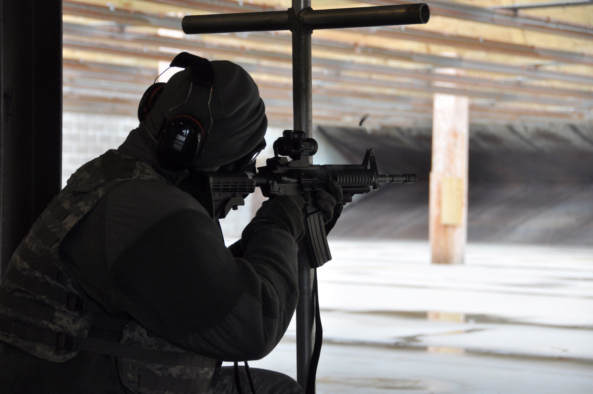 Members from the 507th Security Forces Squadron take part in their annual weapons qualification course for the M-4 and M-9 weapons systems, Nov. 23, 2013.  Senior leaders qualified first, allowing them to assist junior members on the following relay.  Training during the makeup Unit Training Assembly weekend was conducted in 28 degree weather during the morning and day portion of the exercise.  Trainees were required to shoot portions with the M50 gas mask.  All members came back to the range for a night time firing exercise.  (U.S. Air Force photo/Senior Airman Mark Hybers)