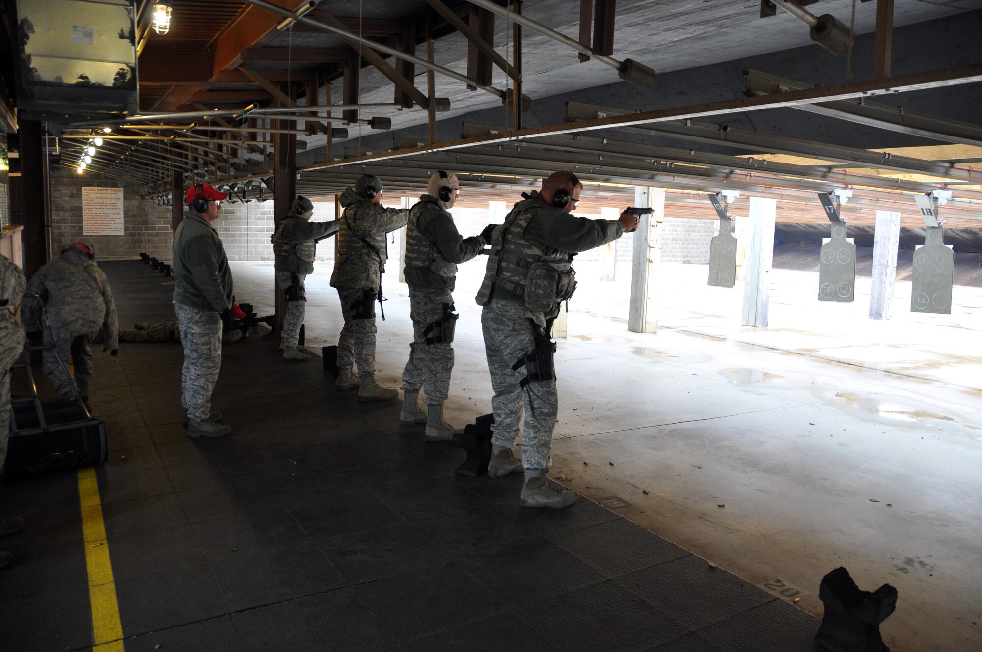 Members from the 507th Security Forces Squadron take part in their annual weapons qualification course for the M-4 and M-9 weapons systems, Nov. 23, 2013.  Senior leaders qualified first, allowing them to assist junior members on the following relay.  Training during the makeup Unit Training Assembly weekend was conducted in 28 degree weather during the morning and day portion of the exercise.  All members came back to the range for a night time firing exercise.  (U.S. Air Force photo/Senior Airman Mark Hybers)