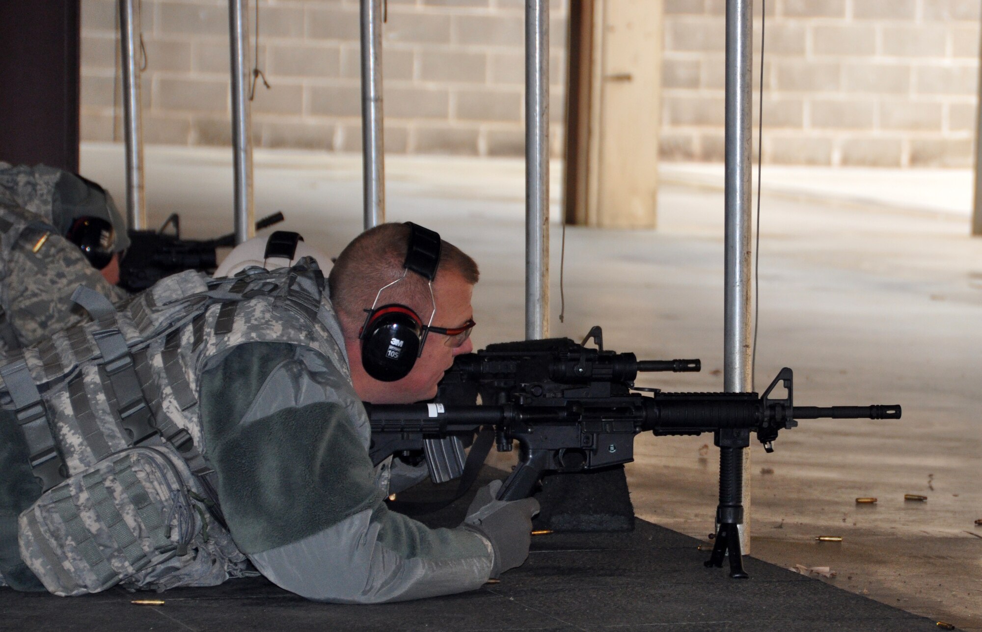 Members from the 507th Security Forces Squadron take part in their annual weapons qualification course for the M-4 and M-9 weapons systems Saturday November 23, 2013.  Senior leaders qualified first, allowing them to assist junior members on the following relay.  Training during the makeup UTA weekend was conducted in 28 degree weather during the morning and day portion of the exercise.  All members came back to the range for a night time firing exercise.  (U.S. Air Force photo/Senior Airman Mark Hybers)