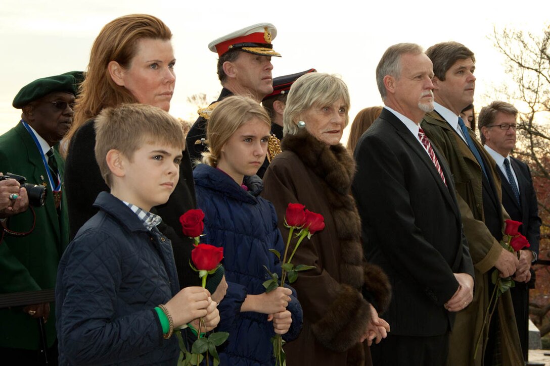 Master Sgt. John Abbracciamento sounds "Taps" at a wreath-laying ceremony at Arlington National Cemetery in honor of President John F. Kennedy on the 50th anniversary of his death. Nov. 22, 2013 (U.S. Marine Corps photo by Staff Sgt. Rachel Ghadiali/Released)