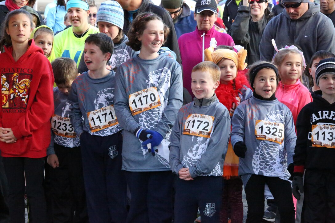 Runners wait for the Turkey Trot Mile to begin aboard Marine Corps Base Quantico on Nov. 23, 2013. The run was the last MCM event of the year.  