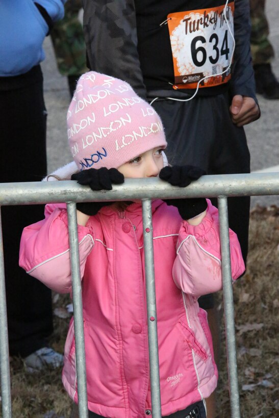Spectators wait for the Turkey Trot Mile to begin aboard Marine Corps Base Quantico on Nov. 23, 2013. The run was the last MCM event of the year.  
