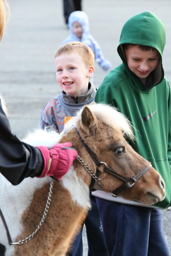 Children visit a petting zoo during the Turkey Trot 10K aboard Marine Corps Base Quantico on Nov. 23, 2013. The run was the last MCM event of the year.  For more information, visit http://go.usa.gov/WfQd