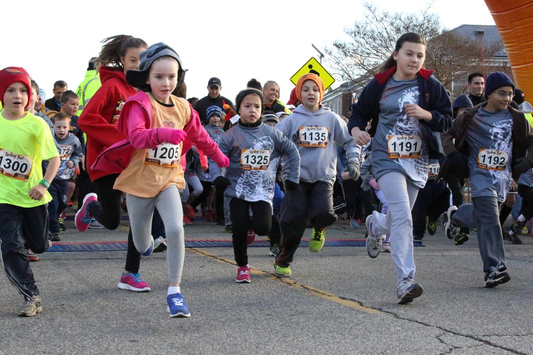 Participants cross the starting line during the Turkey Trot Mile aboard Marine Corps Base Quantico on Nov. 23, 2013. Around 300 people participated in the run. 