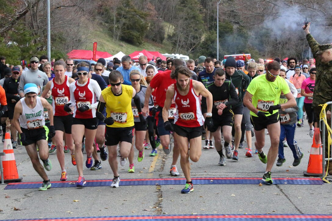 Participants cross the starting line during the Turkey Trot 10K aboard Marine Corps Base Quantico on Nov. 23, 2013. More than 1000 people participated in the run. 