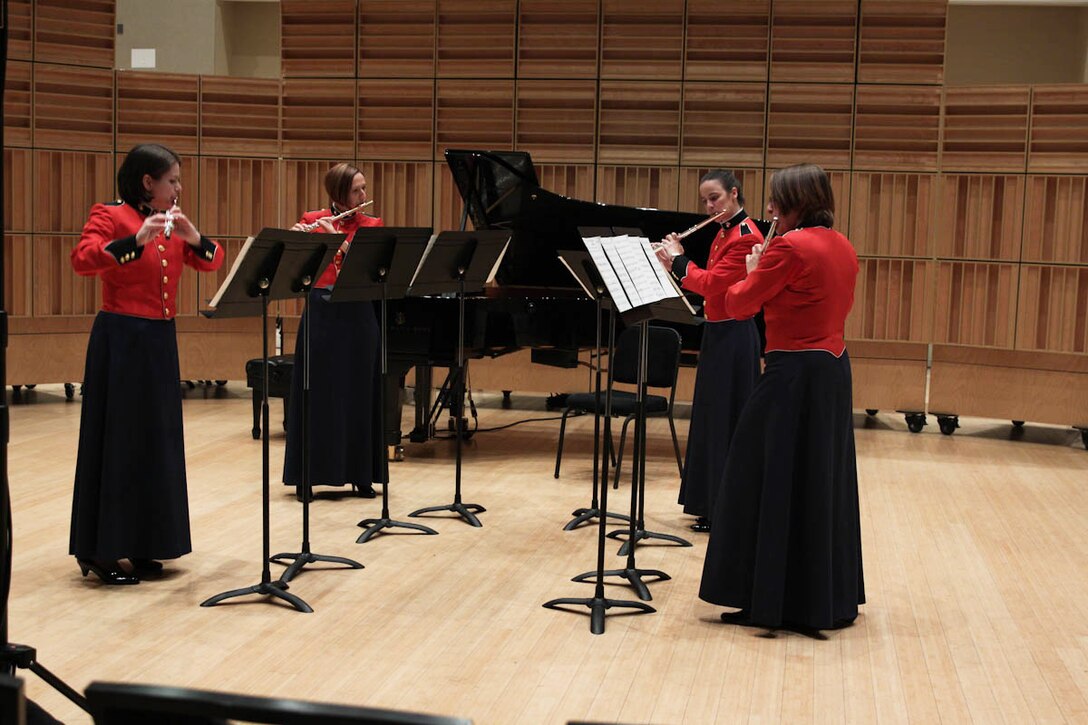 In honor of the 40th anniversary of women joining the Marine Band, “The President’s Own” presents a special recital on Nov. 24. 2013, showcasing the women of today’s Marine Band performing music composed almost entirely by women. The program includes Libby Larsen’s Brazen Overture and Yellow Jersey, Joan Tower’s Platinum Spirals, and Jennifer Higdon’s Steeley Pause. In true Marine fashion, the program concluded with Louis Saverino’s March of the Women Marines, conducted by Assistant Director Capt. Michelle A. Rakers. (U.S. Marine Corps photo by MSgt Kristin S. duBois/released)