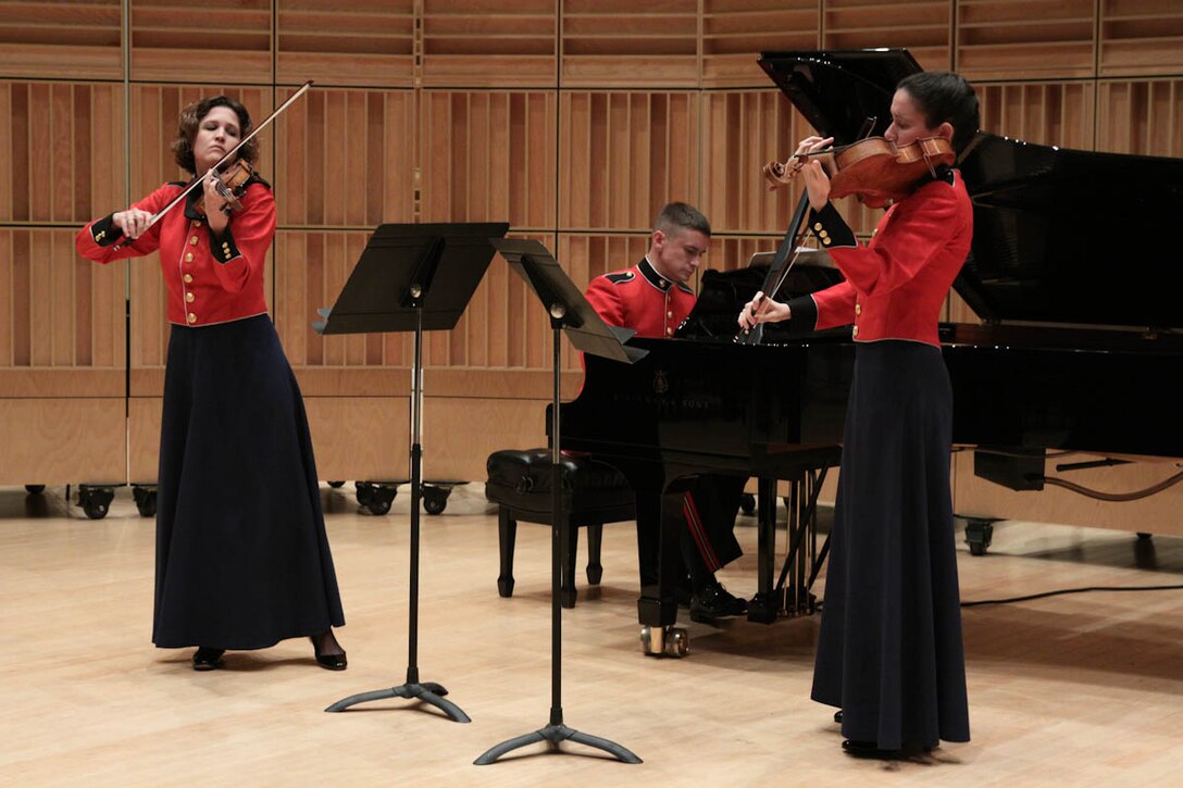 In honor of the 40th anniversary of women joining the Marine Band, “The President’s Own” presents a special recital on Nov. 24. 2013, showcasing the women of today’s Marine Band performing music composed almost entirely by women. The program includes Libby Larsen’s Brazen Overture and Yellow Jersey, Joan Tower’s Platinum Spirals, and Jennifer Higdon’s Steeley Pause. In true Marine fashion, the program concluded with Louis Saverino’s March of the Women Marines, conducted by Assistant Director Capt. Michelle A. Rakers. (U.S. Marine Corps photo by MSgt Kristin S. duBois/released)