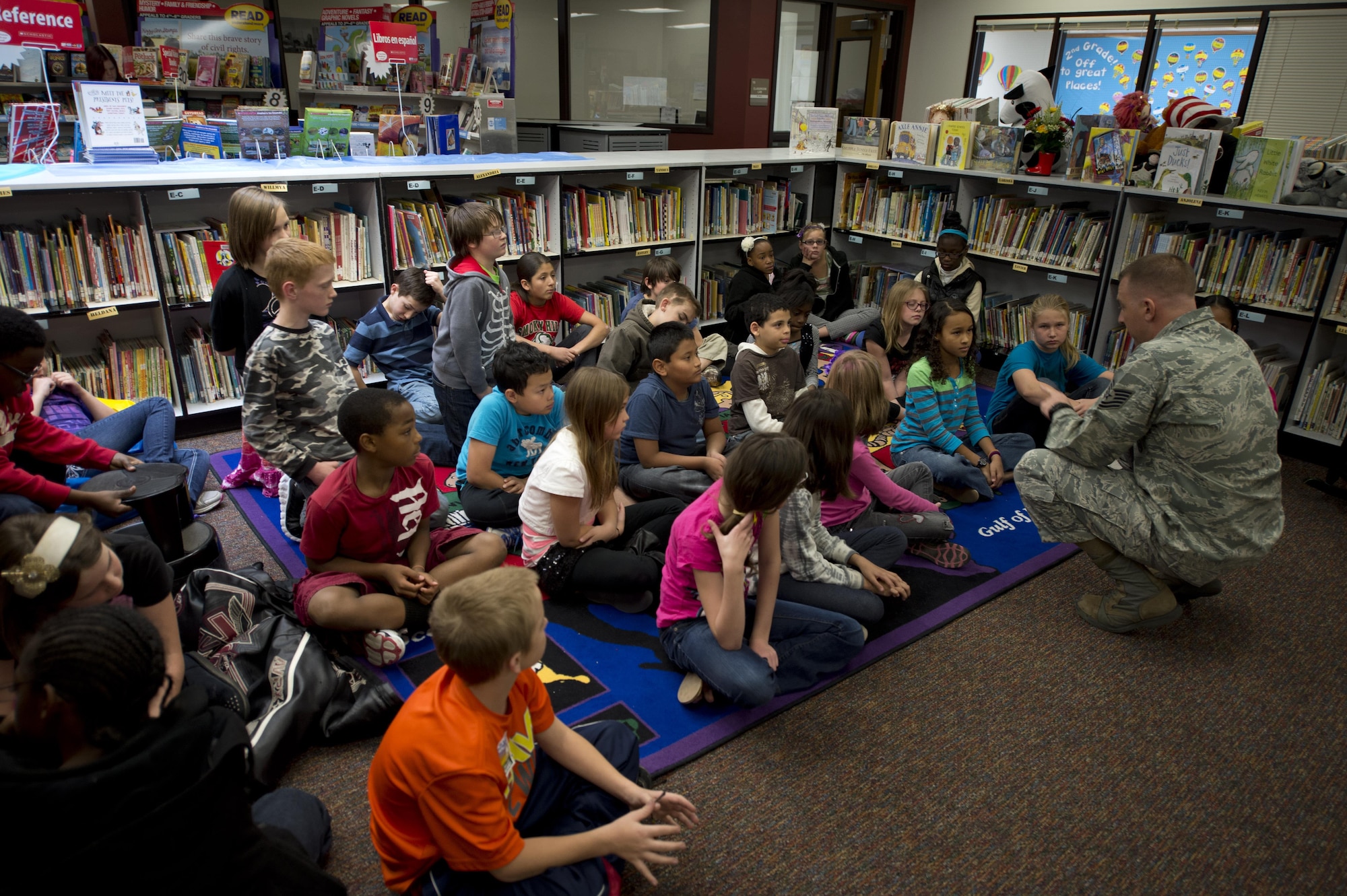 Tech. Sgt. Matthew Zien speaks to students for Veterans Day Nov. 13, 2013, at Cimarron Elementary in Aurora, Colo. Zien hit his lowest low when he nearly lost his life in 2012 to medical issues, and relapsed into post-traumatic stress syndrome. He uses public speaking engagements and mentoring sessions to inspire resiliency for both the public and the Airmen he works with.   