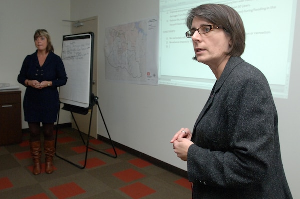 Fort Worth District Planner Nancy Parrish (Right) and Project Manager Nova Robbins facilitate a planning charrette at the U.S. Army Corps of Engineers Nashville District Nov. 20, 2013.  They were asked to conduct the workshop because they both were trailblazers involved in a SMART pilot project called Westside Creeks, an ecosystem restoration in San Antonio, Texas.  In addition, they have conducted SMART initiatives and benefitted from holding a charrette to kick off the planning process for a feasibility study in their home district.