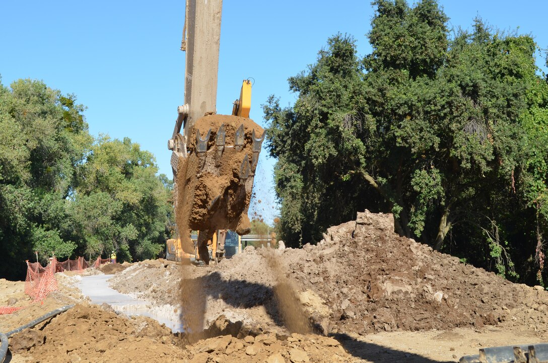 Work continues Oct. 2, 2013, on 3,300 feet of seepage cutoff wall along the north bank of the American River in north Sacramento, Calif. Completion is targeted for mid-October. Construction crews for the U.S. Army Corps of Engineers Sacramento District are helping ensure the levee's height and slope will be brought back to pre-construction levels by November 1 – in time for the rainy season.