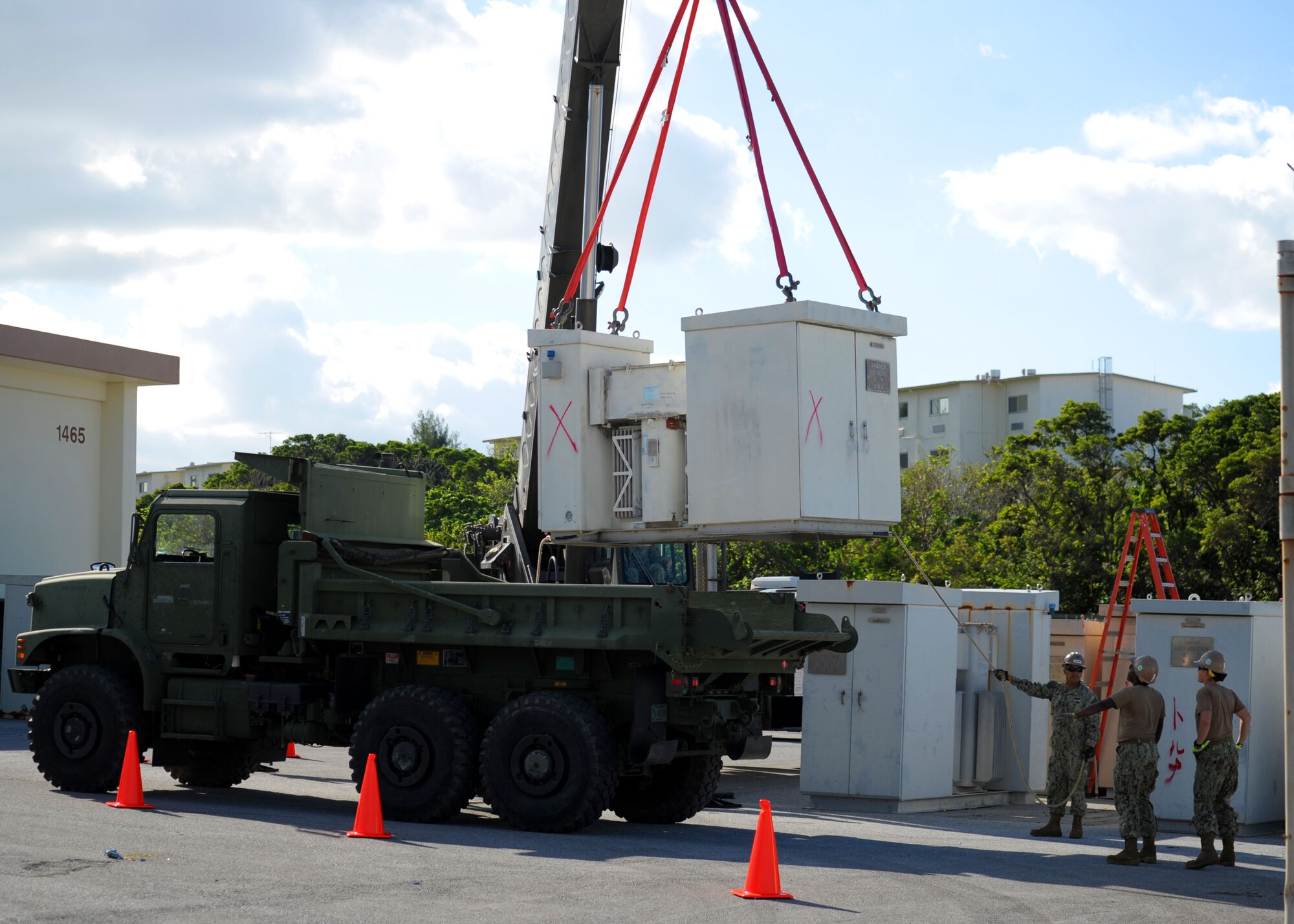 Seabees assigned to Naval Mobile Construction Battalion (NMCB) 3's crane crew use a 40-ton hydraulic crane to replace a 6,000-pound transformer that powers portions of Kadena Air Base, Okinawa, Japan, Nov. 21, 2013. For this deployment, NMCB 3 has split into nine details to perform critical construction projects in remote island areas such as Timor-Leste, Tonga, Cambodia and the Philippines. The teams will also conduct operations in Atsugi, Yokosuka and Okinawa, Japan; Chinhae, Republic of Korea and China Lake, Calif. (U.S. Navy photo by Mass Communication Specialist 1st Class Chris Fahey)