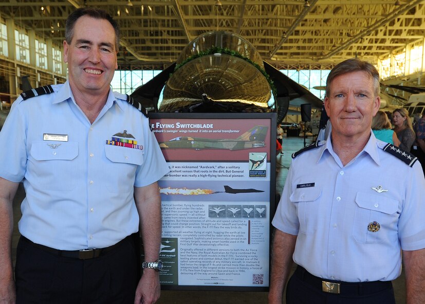 (From left) Air Marshal Geoffrey Brown, Royal Australian Air Force Chief of Air Force, and Gen. Hawk Carlisle, commander of Pacific Air Forces, pose for a photo in front of a Royal Australian Air Force F-111C after a dedication ceremony at the Pacific Aviation Museum, Ford Island, Hawaii, Nov.23, 2013. The RAAF’s gift of the F-111C to the Museum is a reminder of the F-111’s shared service between Australia and the United States.  (U.S. Air Force photo/Tech Sgt. Jerome S. Tayborn/Released)