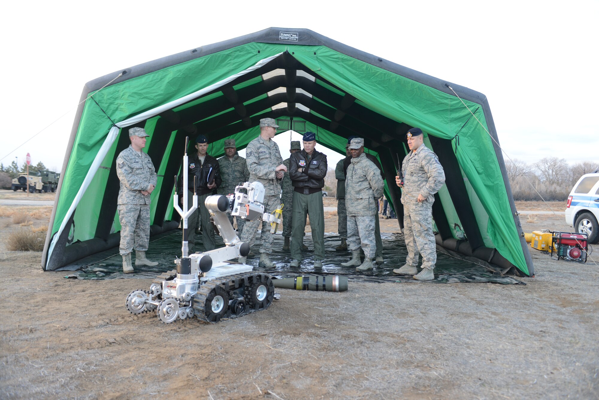 U.S. Air Force Lt. Gen. Tod Wolters, 12th Air Force (Air Forces Southern) commander, and Chief Master Sgt.Calvin Williams, 12th Air Force (Air Forces Southern) command chief, receive a briefing about the capabilities of the Andros F-6 robot Nov. 19, 2013, at Mountain Home Air Force Base, Idaho. General Wolters and Chief Master Sgt. Williams witnessed the capabilities of the 366th Mission Support Group which provides all personnel, communications, base security, civil engineering, logistics, contracting and morale programs to the wing's three fighter squadrons and more than 4,800 personnel. (U.S. Air Force photo by Senior Airman Benjamin Sutton/Released)