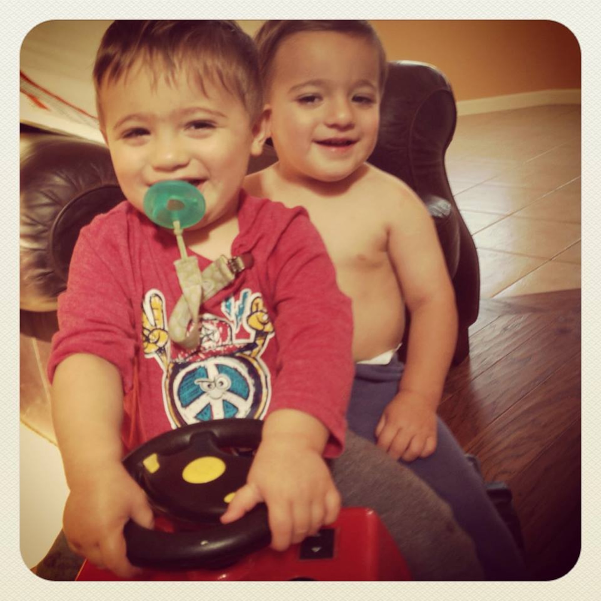 VANDENBERG AIR FORCE BASE, Calif. -- (Front to back) Rocco and Enzo Picariello, twin sons of Team V members, Capt. Joseph Picariello and Staff Sgt. Erica Picariello, ride a power wheel monster truck Sept. 14. Rocco and Enzo were born 10 weeks premature and are now healthy young boys. (Courtesy photo)
