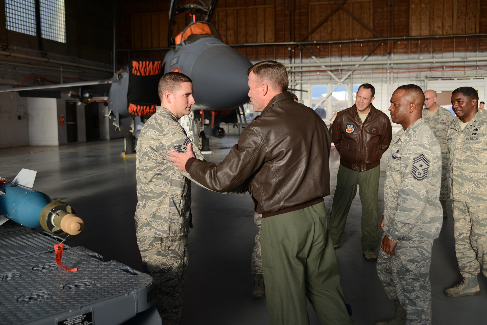 U.S. Air Force Lt. Gen. Tod Wolters, 12th Air Force (Air Forces Southern) commander, shakes hands with Staff Sgt. Josh Paige, 366th Aircraft Maintenance Squadron crew chief, Nov. 19, 2013, at Mountain Home Air Force Base, Idaho. The 366th AMXS is responsible for the flightline maintenance of 48 F-15E aircraft in the 389th and 391st Aircraft Maintenance Units and 12 F-15SG aircraft in the 428th AMU. (U.S. Air Force photo by Senior Airman Benjamin Sutton/Released)