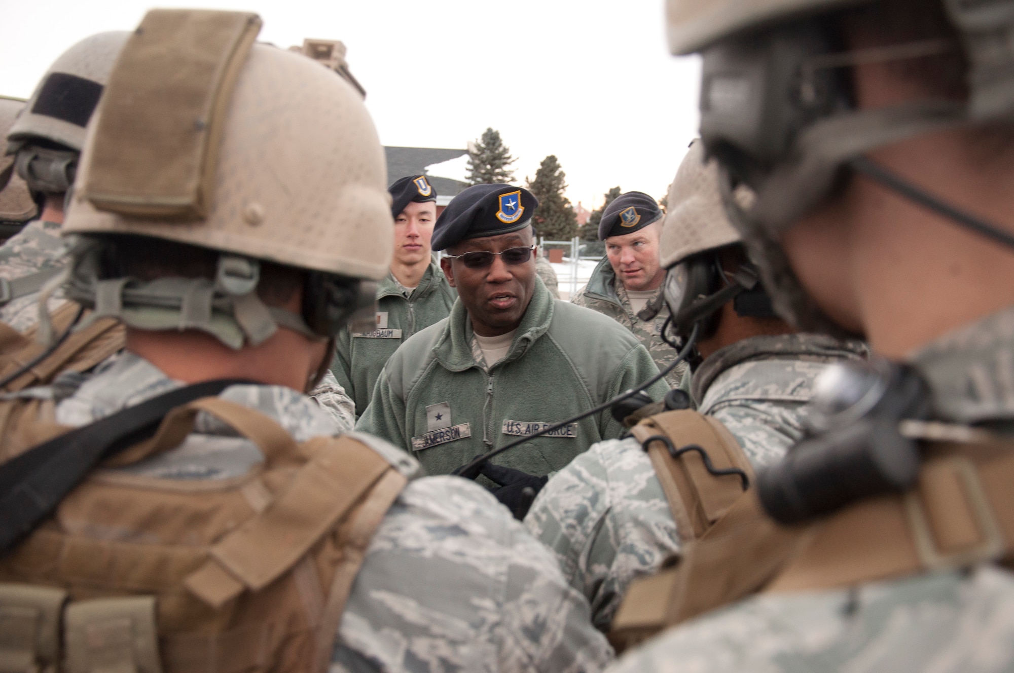 Brig. Gen. Allen Jamerson, Director of Security Forces, Deputy Chief of Staff for Logistics, Installations and Mission Support, Headquarters U.S. Air Force, Washington, speaks with Airmen from the 790th Missile Security Forces Squadron after they performed a mock launch facility recapture Nov. 22, 2013. Jamerson talked to the Airmen to ask them about the condition of the base, the equipment they use and to see if there was anything that he could do to make their job easier. (U.S. Air Force photo by Airman 1st Class Brandon Valle)