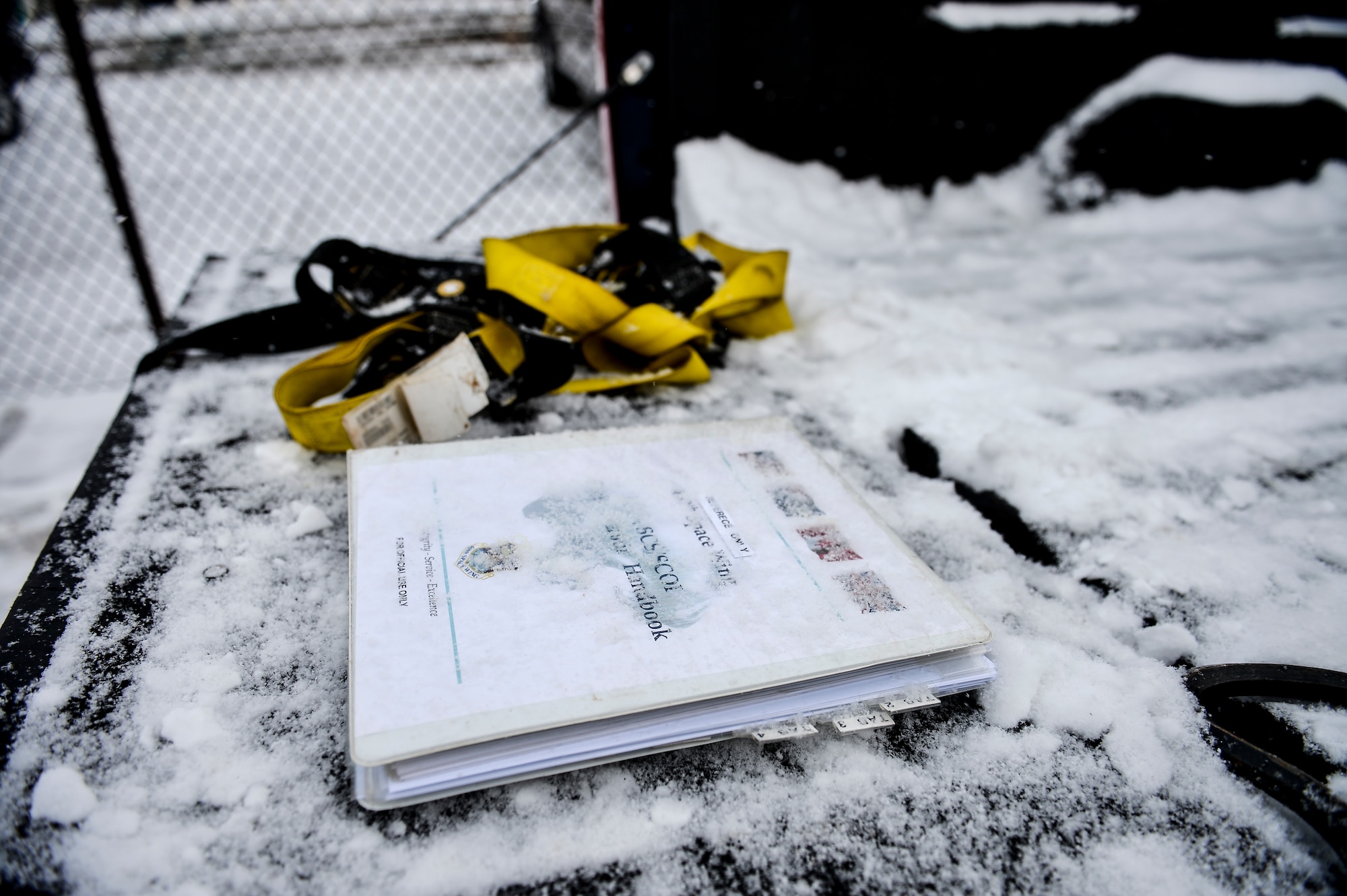 Members of the 460th Space Communications Squadron Cable Antenna Systems Office performed confined-spaces training Nov. 21, 2013, near the 460th SCS building on Buckley Air Force Base, Colo. Regardless of the weather, cable antenna systems technicians are required to complete confined-spaces training as part of on-the-job training. (U.S. Air Force photo by Senior Airman Riley Johnson/Released)