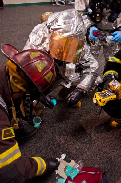 The Vacaville Police Department and the Travis Fire Fighters combine efforts to form the hazardous materials team Nov. 14 during the school shooting exercise at Sierra Vista Elementary in Vacaville, Calif. The team recovered an unknown substance left by the perpetrator. (U.S. Air Force photo/Senior Airman Madelyn Brown)

