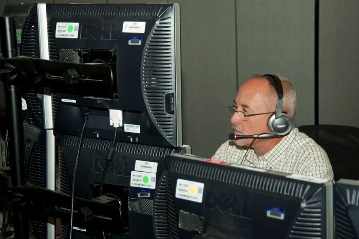 Greg Sprang, 505th Training Squadron program analyst, monitors multiple screens during a test Nov. 21, 2013, at Nellis Air Force Base, Nev. The test is focused on building tactics, techniques and procedures to defend or work around degraded operations in an Air Operations Center. The test kicked off Nov. 18 and is expected to run until the end of the fiscal year. (U.S. Air Force photo by Airmen 1st Class Timothy Young)