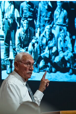 2nd Lt. retired Dean Whitaker, B-17 Flying Fortress pilot and World War II veteran, points himself out in an old squadron photo dated back to 1946 during a WWII Veteran's breakfast Nov. 22, 2013, inside the Club at Nellis Air Force Base, Nev. Whitaker was assigned to the 8th Air Force in southern England at the time. (U.S. Air Force photo/Senior Airman Brett Clashman)
