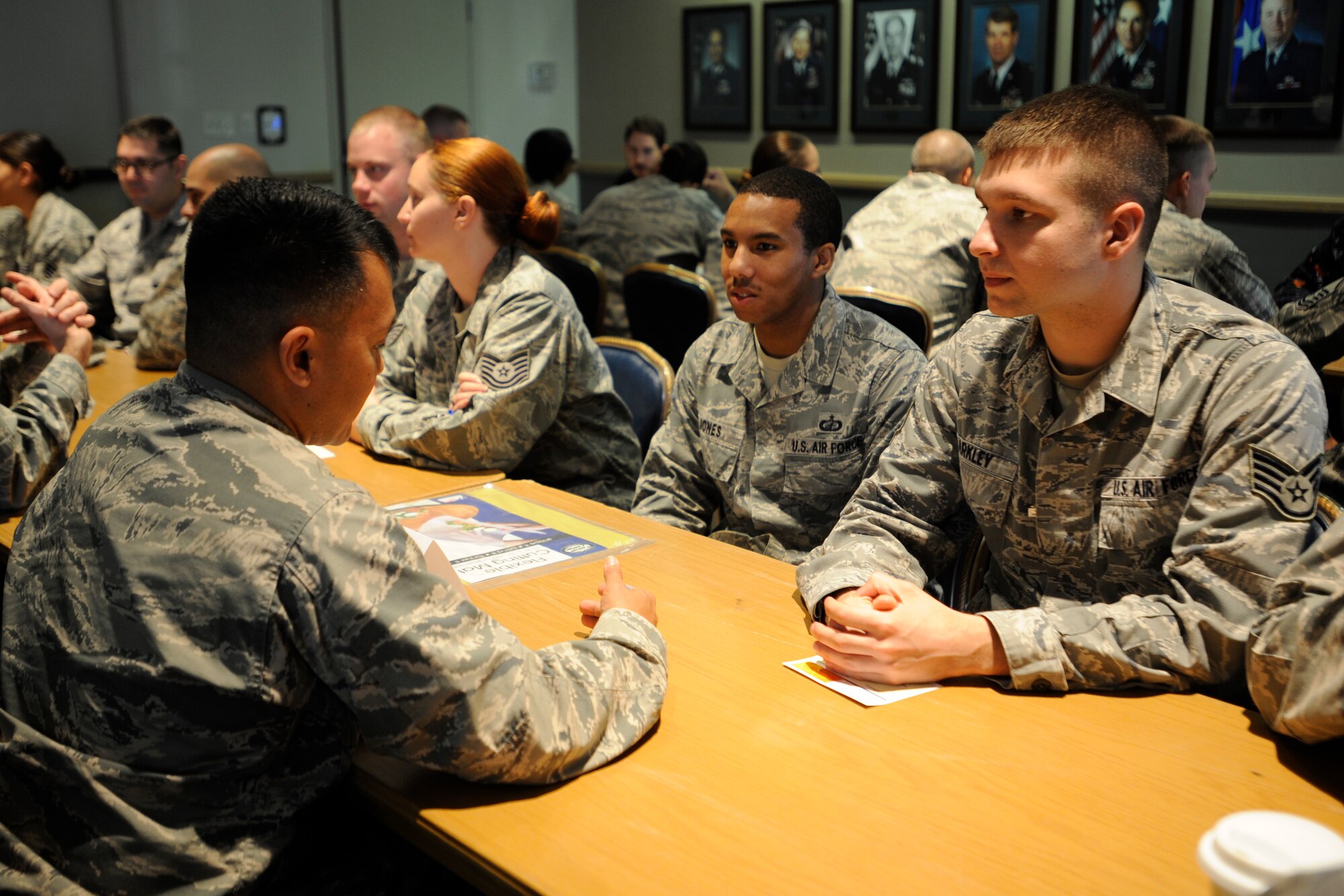VANDENBERG AIR FORCE BASE, Calif. – Col. Marcelino Del Rosario, 30th Operations Group commander, mentors Staff Sgt. Raymond Barkley, 30th Space Wing executive assistant and SSgt. Tony Jones, 30th Comptrollers Squadron accounting technician here Nov. 19, 2013. Team V members had the opportunity to ask questions during 6 minute speed mentoring sessions  aimed to provide career and professional advice. (U.S. Air Force photo/ Airman 1st Class Yvonne Morales)