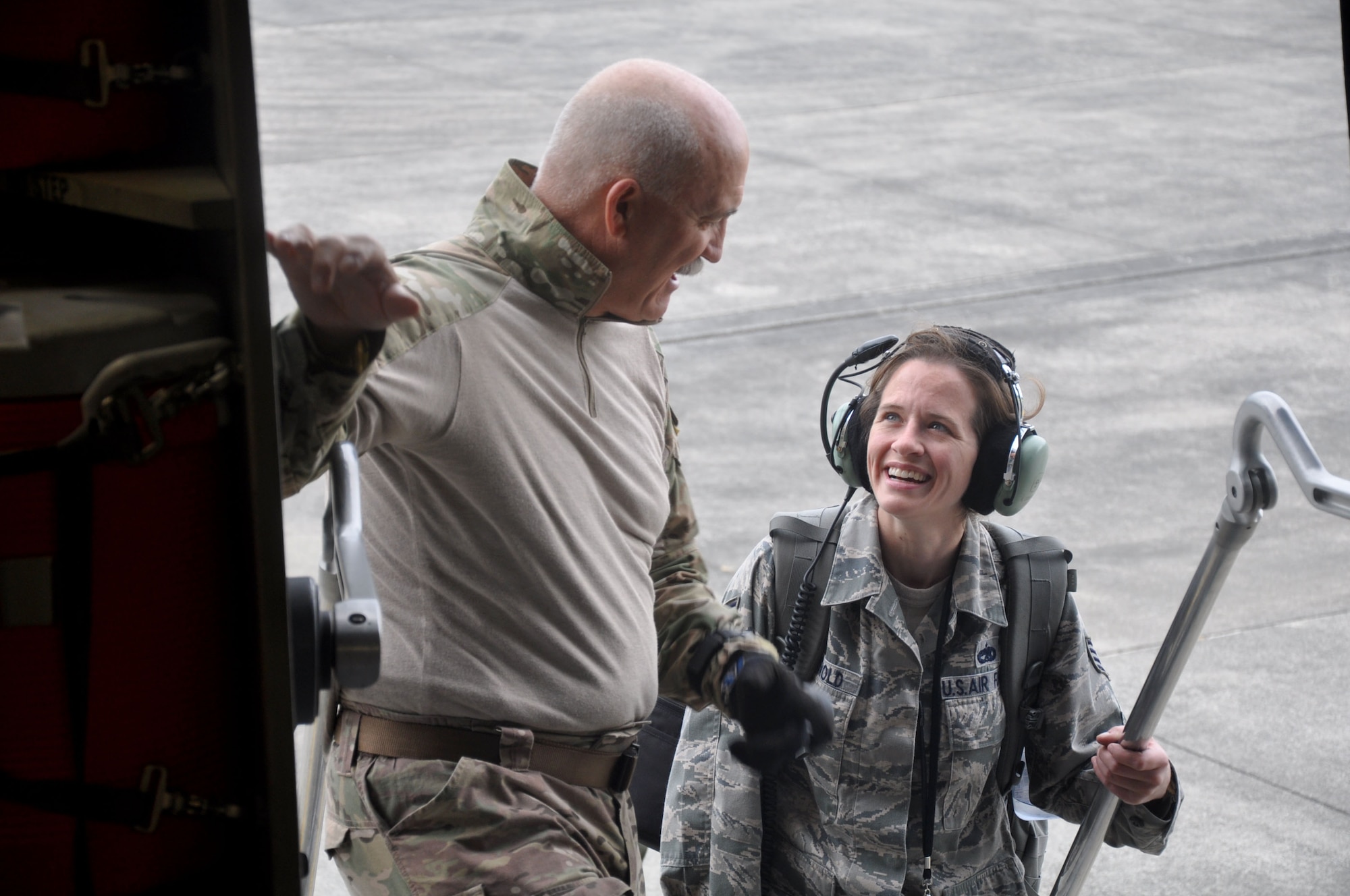 OHAKEA, New Zealand -- Chief Master Sgt. Paul Koester, 517th Expeditionary Airlift Squadron jumpmaster and Staff Sgt. Kristen Griswold climb the steps into a C-17 Globemaster III in preparation for cargo and personnel drops during the multilateral RNZAF-sponsored tactical airlift exercise, Kiwi Flag, at Royal New Zealand Air Force Base Ohakea, New Zealand. Kiwi Flag personnel are supporting Exercise Southern Katipo -- held in New Zealand’s South Island -- by managing air operations and providing cargo and passenger airlift including tactical air drops to SK participants. (U.S. Air Force photo by Senior Master Sgt. Denise Johnson/Released)