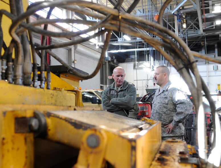 Chief Master Sgt. Brian Hornback, Air Force Global Strike Command command chief, talks to a 509th Logistics Readiness Squadron member during his tour at Whiteman Air Force Base, Mo., Nov. 13, 2013. Whiteman is the first stop on Hornback’s farewell tour as he prepares to retire. (U.S. Air Force photo by Staff Sgt. Alexandra M. Boutte/Released)