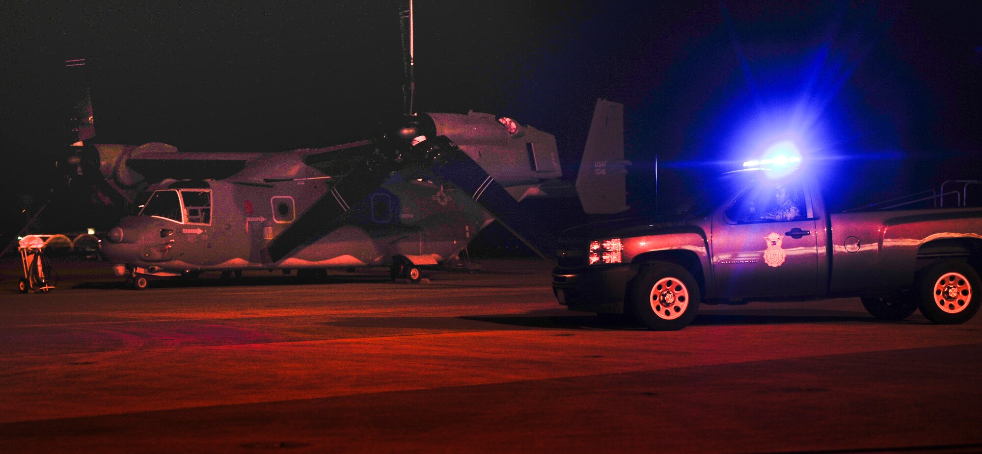 Senior Airman Kelvin Eusebio, 1st Special Operatons Security Forces Sqaudron patrolman, guards a CV-22 on the flightline at Hurlburt Field, Fla., Nov. 19, 2013. Eusebio patrolled the flightline to ensure there were no unauthorized individuals. (U.S. Air Force photo/Senior Airman Krystal M. Garrett) 