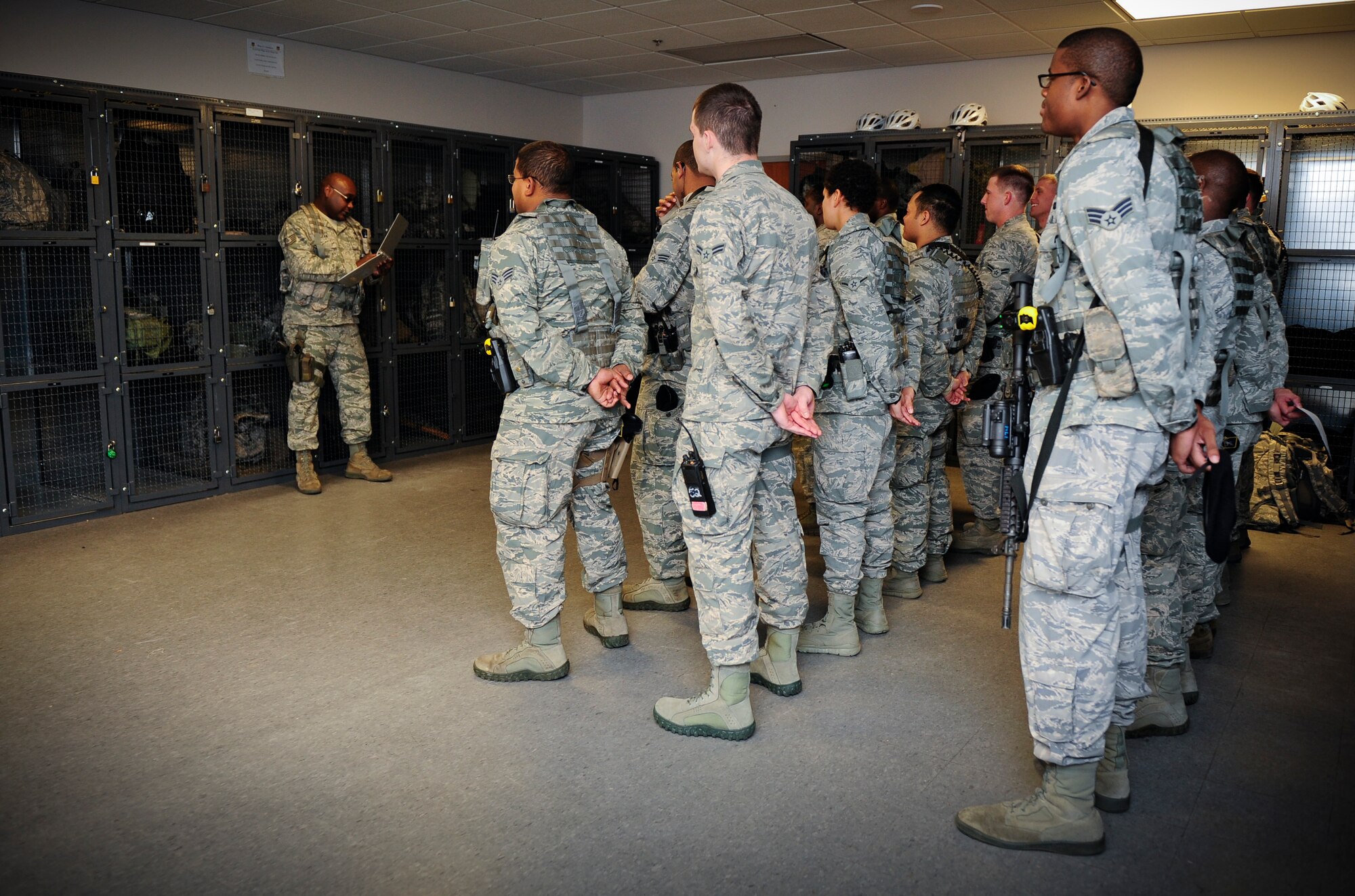 Airmen gather for the nightly guard mount on Hurlburt Field, Fla., Nov. 19, 2013. The guard mount brief informed security forces Airmen about the current base status and upcoming events prior to their shift. (U.S. Air Force photo/Senior Airman Krystal M. Garrett)