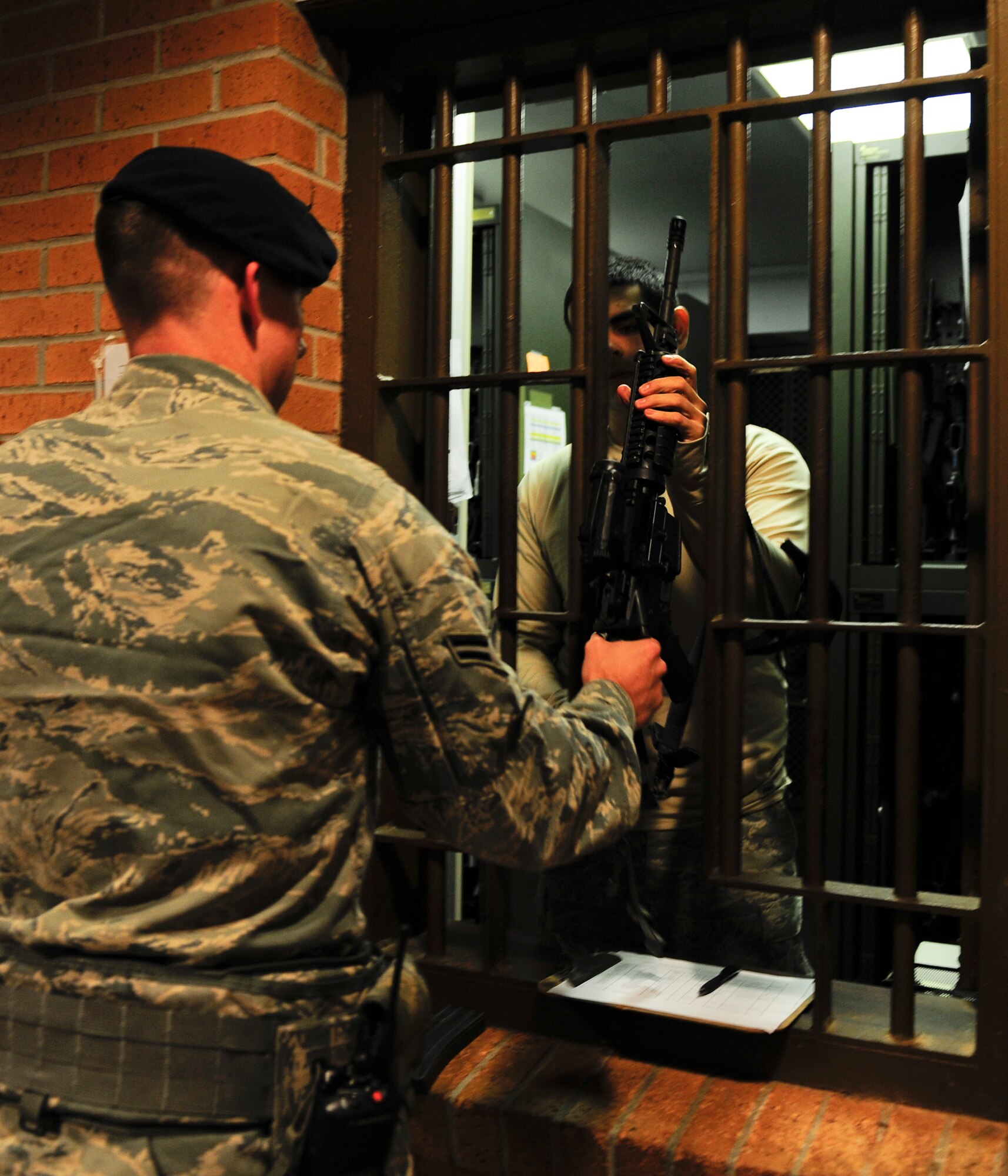 A security forces patrolman checks out an M-4 at the armory on Hurlburt Field, Fla., Nov. 19, 2013. The armory issues weapons to security forces Airmen for their shift. (U.S. Air Force photo/Senior Airman Krystal M. Garrett)