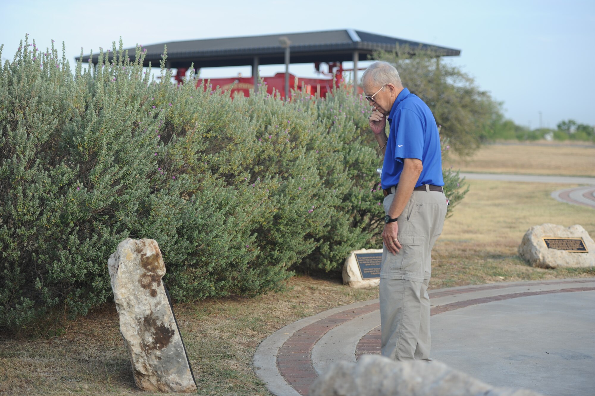 GOODFELLOW AIR FORCE BASE, Texas -- Dr. Mike Manning, a former Air Force firefighter, looks over the names of fallen firefighters at the Department of Defense Fallen Firefighters Memorial Sept. 16. Manning enlisted in the Air Force in 1961 and served for seven years. (U.S. Air Force photo/ Staff Sgt. Laura R. McFarlane)