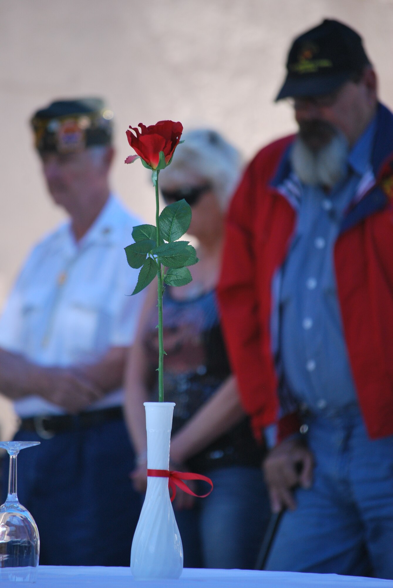 A rose stands at the POW MIA table at a Veteran’s Day ceremony at the Panama City Rescue Mission Nov. 11. The event provided free meals to homeless veterans.