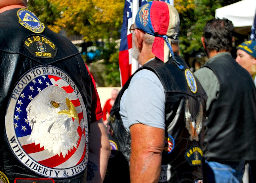 A group of motorcycle riders stand proudly during a ceremony honoring veterans at the Panama City Rescue Mission Nov. 11. The event provided free meals to homeless veterans.