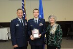 Col. Gerald Goodfellow, 12 Flying Training Wing commander, Joint Base San Antonio-Randolph, and Mrs. Susan Green Tillman, State Recording Secretary of Texas, Daughters of the American Revolution, present Capt. Brian Thalhofer with the Instructor Pilot of the Year Award. (U.S. Air Force Photo by Rich McFadden)