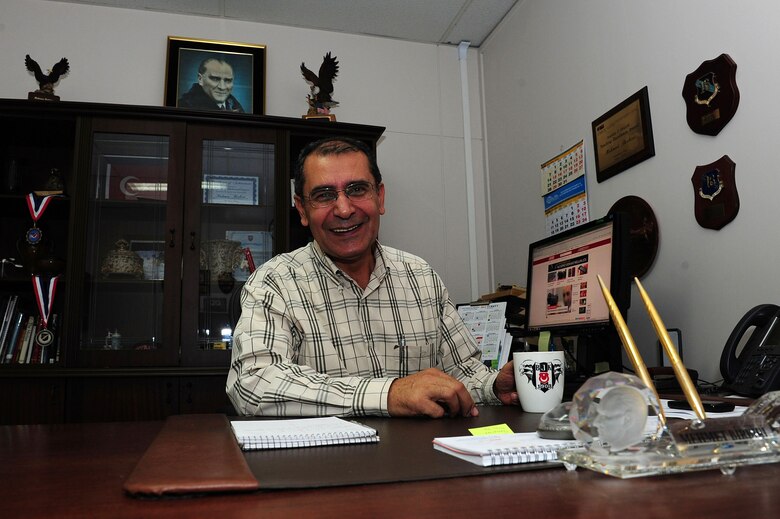 Mehmet Birbiri, 39th Air Base Wing host nation advisor, enjoys a cup of coffee at his desk Nov. 25, 2013, at Incirlik Air Base, Turkey.  Birbiri has worked on Incirlik AB for 39 years.  (U.S. Air Force photo by Airman 1st Class Nicole Sikorski/Released) 