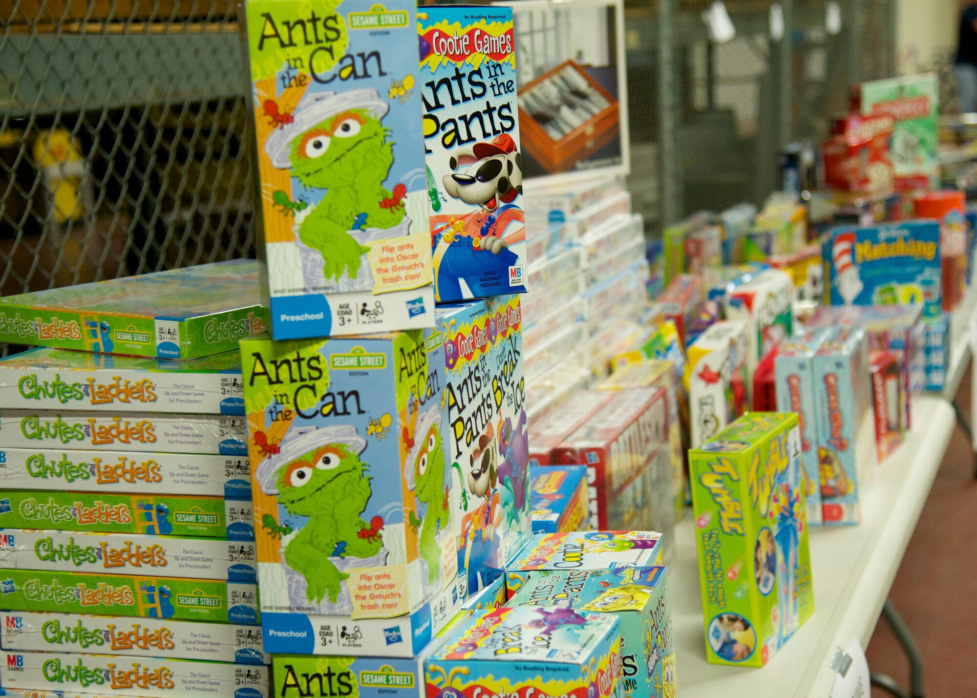 Dozens of board games line the table for the 10th annual toy drive hosted by the Airman’s Attic at Eglin Air Force Base, Fla., Nov. 22. More than 11,000 toys were donated for the drive, helping more than 300 families in the Eglin community. (U.S. Air Force photo/Sara Vidoni)