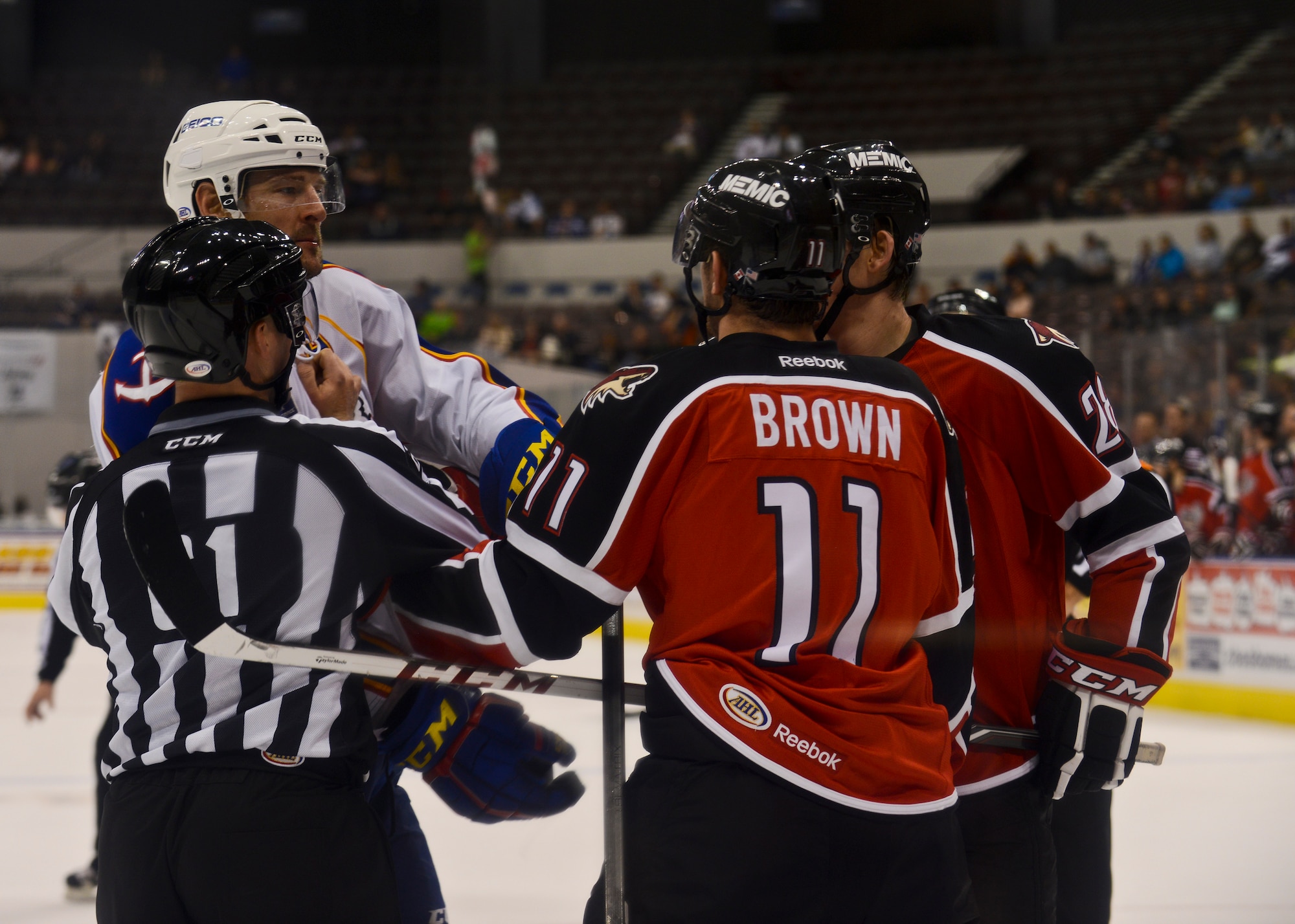 Referees break up a fight between players during the Norfolk Admirals Military Appreciation Night hockey game in Norfolk, Va., Nov. 22, 2013.  The game was held in support of Service members in the community. (U.S. Air Force photo by Airman 1st Class Victoria H. Taylor/Released)