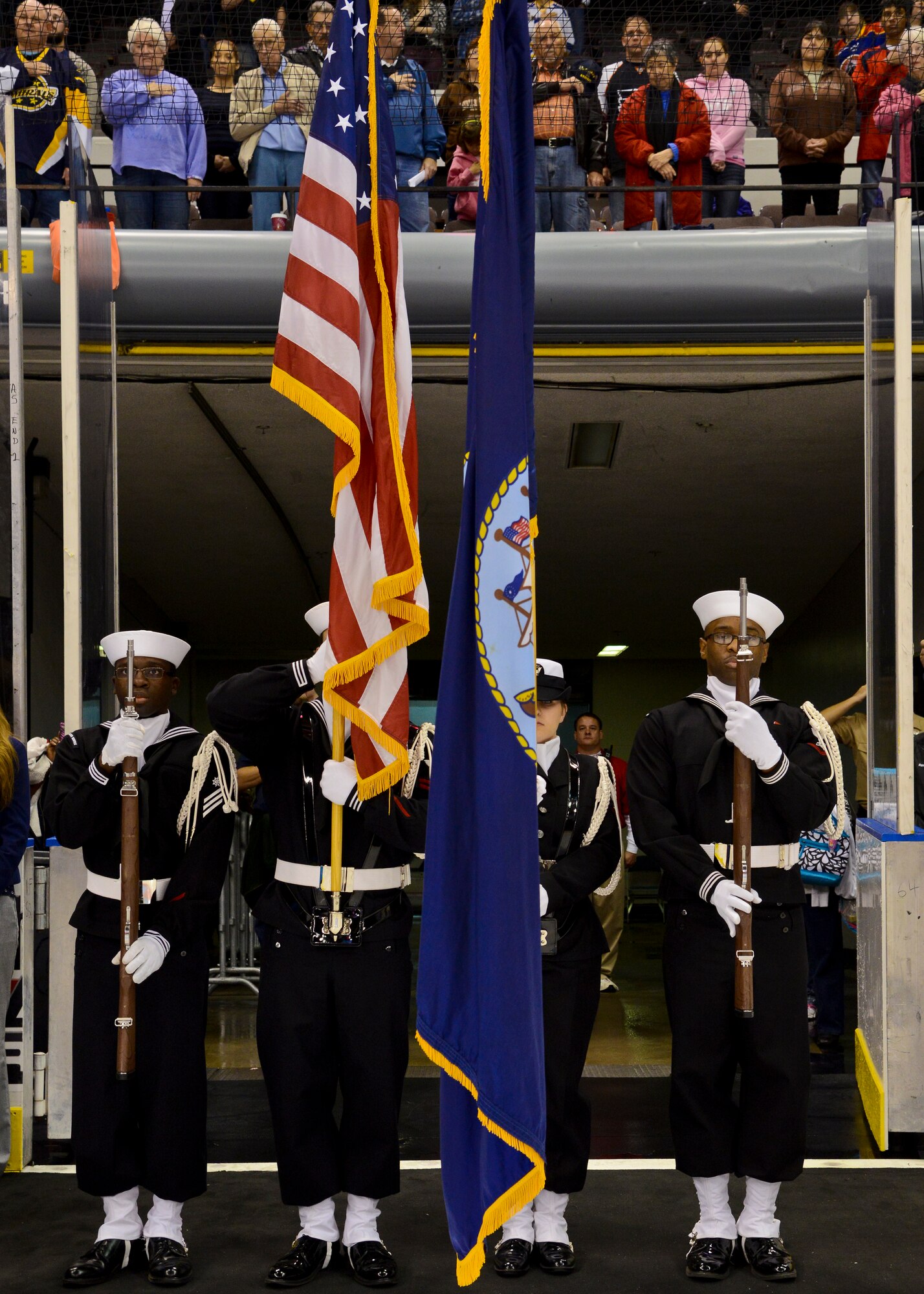 The Naval Station Norfolk color guard presents the colors during the Norfolk Admirals Military Appreciation Night hockey game in Norfolk, Va., Nov. 22, 2013.  This is the fifth annual military appreciation night hosted by the  Norfolk Scope ice arena. (U.S. Air Force photo by Airman 1st Class Victoria H. Taylor/Released) 