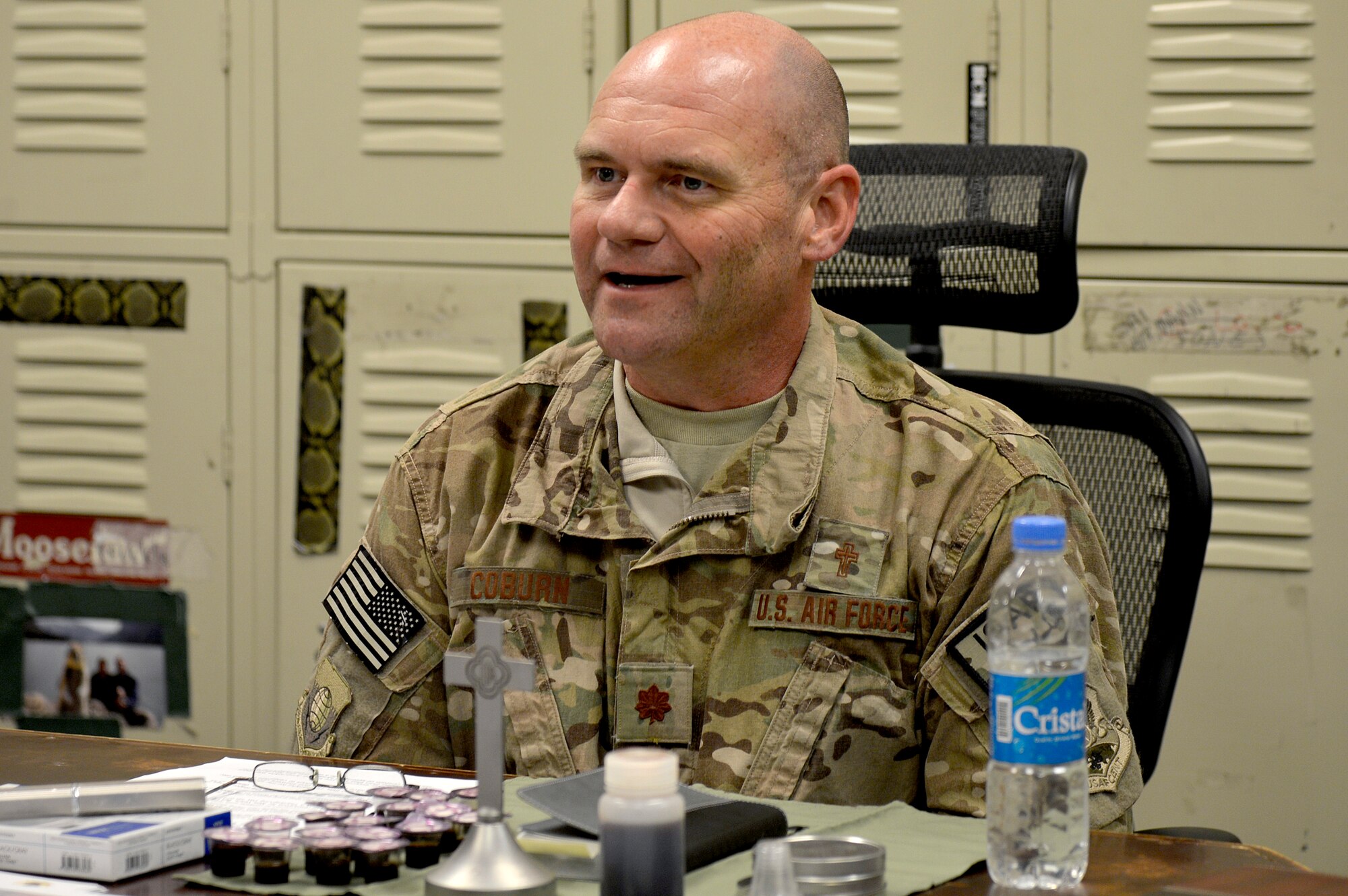 U.S. Air Force Chaplain (Maj.) Gary Coburn, 455th Air Expeditionary wing, visits the 83rd Expeditionary Rescue Squadron at Bagram Airfield, Afghanistan, Nov. 24, 2013. Coburn held a small service for Airmen assigned to the 83rd ERQS in their briefing room. Coburn is deployed from Buckley Air Force Base, Colo. (U.S. Air Force photo by Senior Airman Kayla Newman/Released)