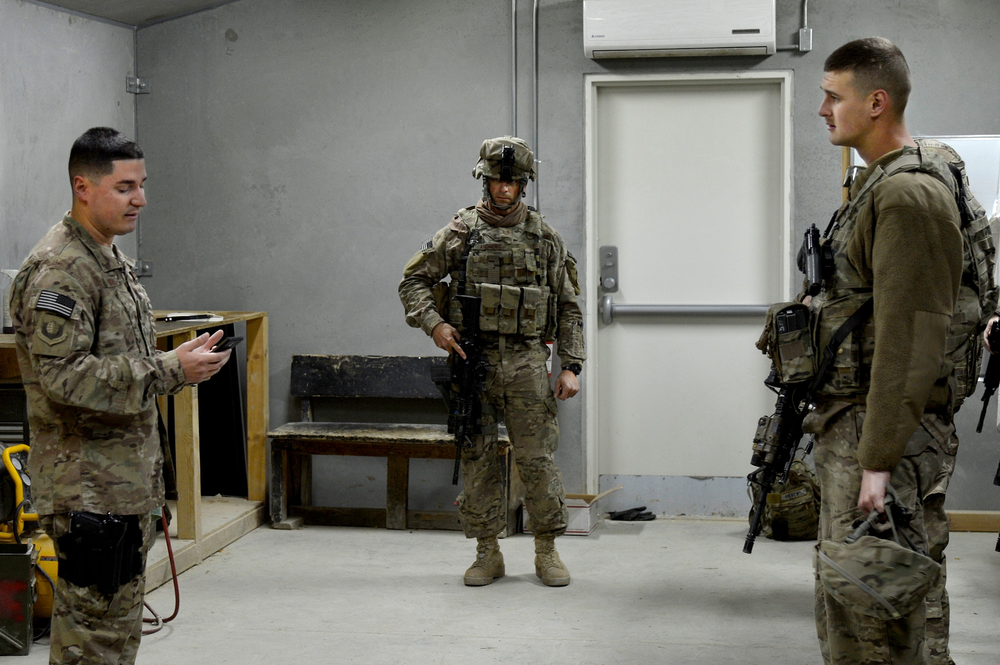U.S. Air Force Staff Sgt. Frank Rivas, 455th Air Expeditionary Wing chaplain assistant, reads a motivational quote for Airmen of the 455th Expeditionary Base Defense Squadron at Bagram Airfield, Afghanistan, Nov. 24, 2013. Rivas visited with the Airmen during guard mount. Rivas is deployed from MacDill Air Force Base, Fla. and hails from Miami, Fla. (U.S. Air Force photo by Senior Airman Kayla Newman/Released)