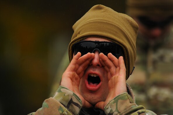 SPANGDAHLEM AIR BASE, Germany—U.S. Air Force Airman 1st Class Austin Hisel, a 52nd Civil Engineer Squadron Explosive Ordnance Disposal apprentice from Kankakee, Ill., shouts during a pumpkin demo training session Nov. 6, 2013. Hisel and other EOD flight members participated in the training to fulfill upgrade and annual training requirements. (U.S. Air Force photo by Senior Airman Rusty Frank/Released)