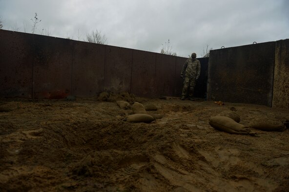 SPANGDAHLEM AIR BASE, Germany--Staff Sgt. Stephen Lynch, a 52nd Civil Engineer Squadron Explosive Ordnance Disposal journeyman from Chicago, Ill., looks over part of the EOD range during a pumpkin demo training session WHEN. The training was hosted to ensure EOD training qualifications were met. (U.S. Air Force photo by Senior Airman Rusty Frank/Released)