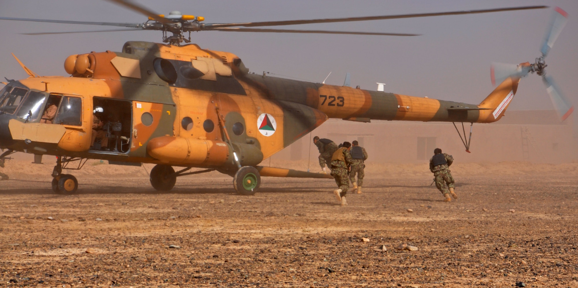 Kandahar Air Wing Security Forces Kandak Airmen conduct a hot load exfiltration exercise Nov. 10, 2013 near Kandahar Airfield, Afghanistan. The security forces members conducted fly away security training with advisors from NATO Air Training Command-Afghanistan, including infiltration and exfiltration, cold load training, where the Airmen practice loading and unloading without helicopter blades running, and hot load training, where the blades are running. The class was led by Master Sgts. Patrick Flores and Olivia McMahon, 443rd Air Expeditionary Advisory Squadron security forces. (U.S. Air Force photo/Capt. Anastasia Wasem)